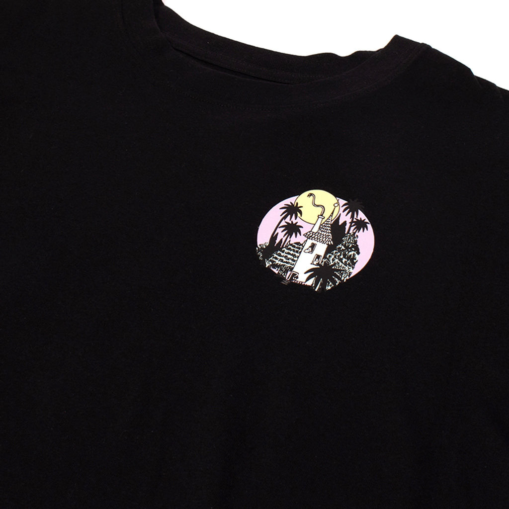 3. Close-up of small circular Moomin logo on black t-shirt