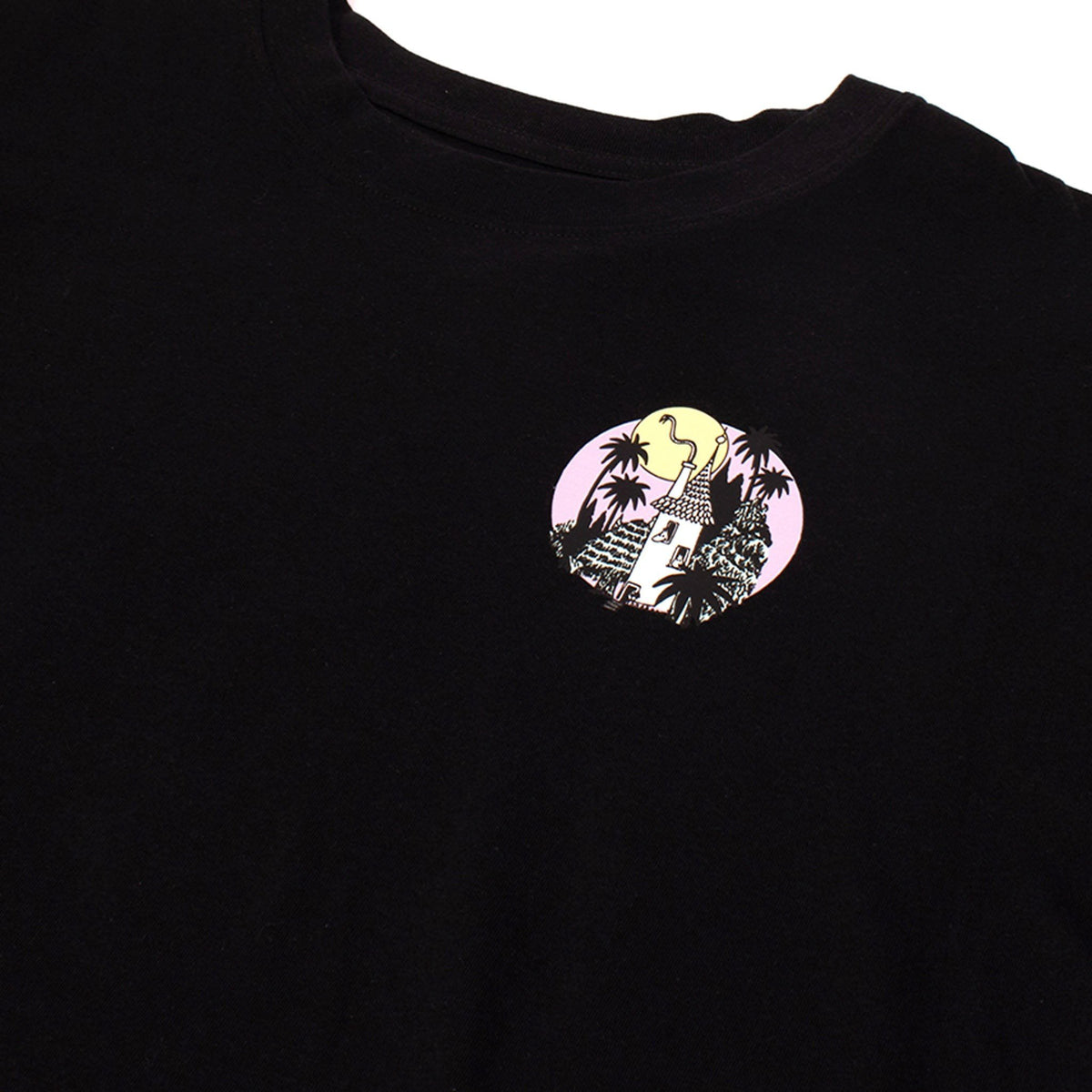 3. Close-up of small circular Moomin logo on black t-shirt