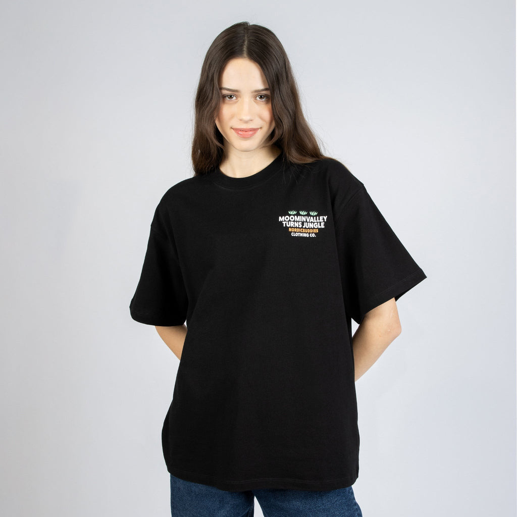 2. Women's black Moomintroll Jungle t-shirt with front logo, styled casually in studio