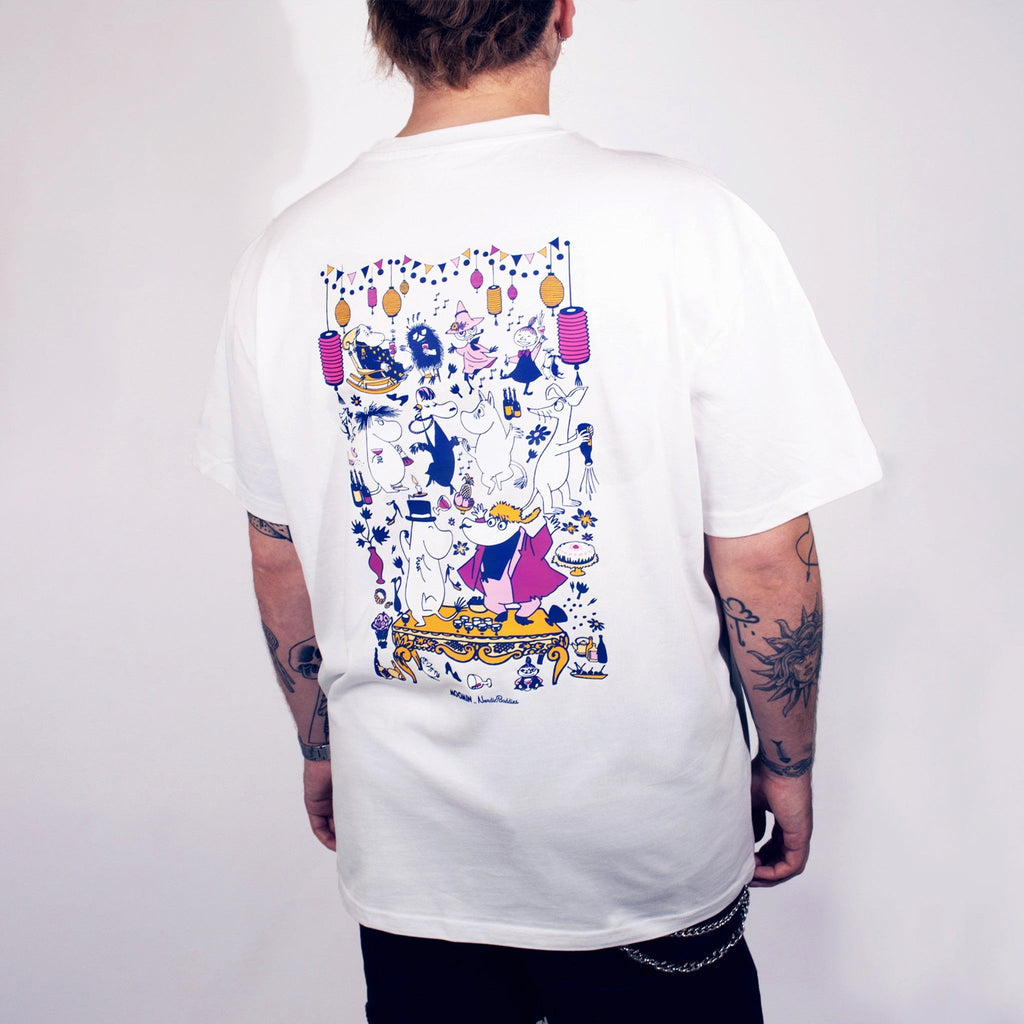 1. Person wearing white unisex Moomin Party T-shirt with colorful back print, studio setting