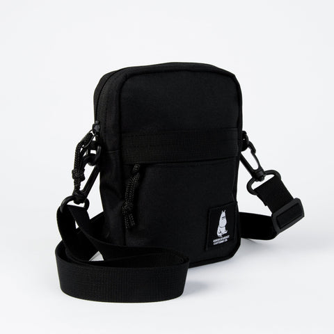4. Black Moomin by NordicBuddies cross body bag angled view showing side strap and Moomin logo on white background