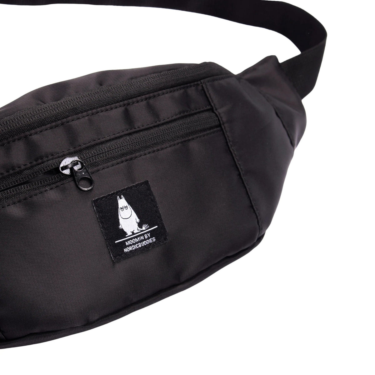 2. Close-up of Moomin by NordicBuddies black waist bag showing Moomintroll logo and front zipper