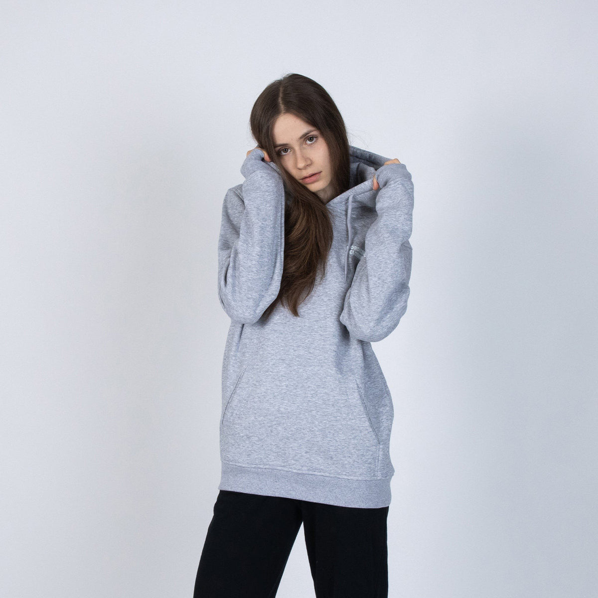 5. Unisex grey Moomintroll's Temper Hoodie worn by female model, front view in studio