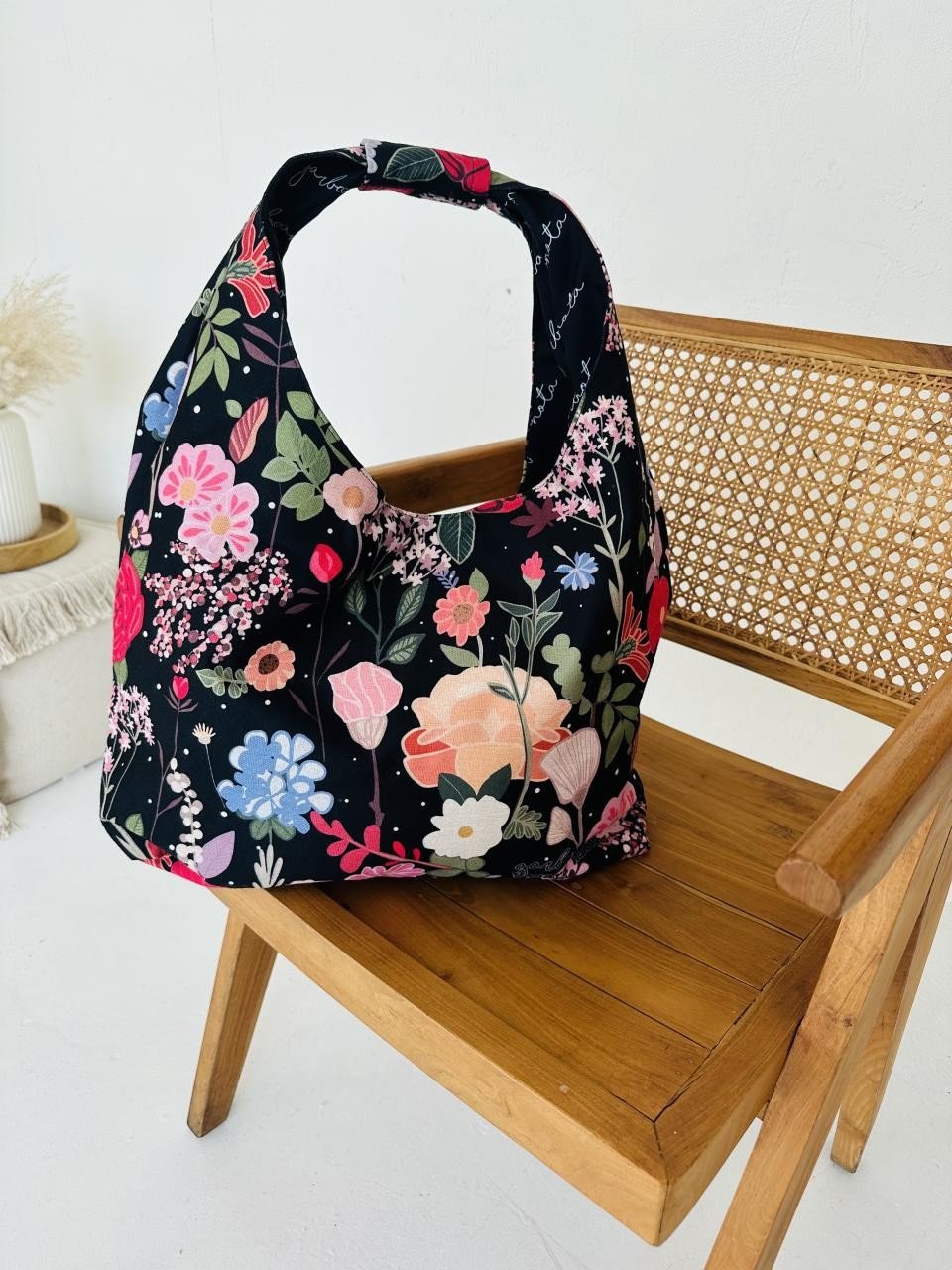 8. Garbanota Moon Bag - Curly Summer Night with floral design on wooden chair, lifestyle setting