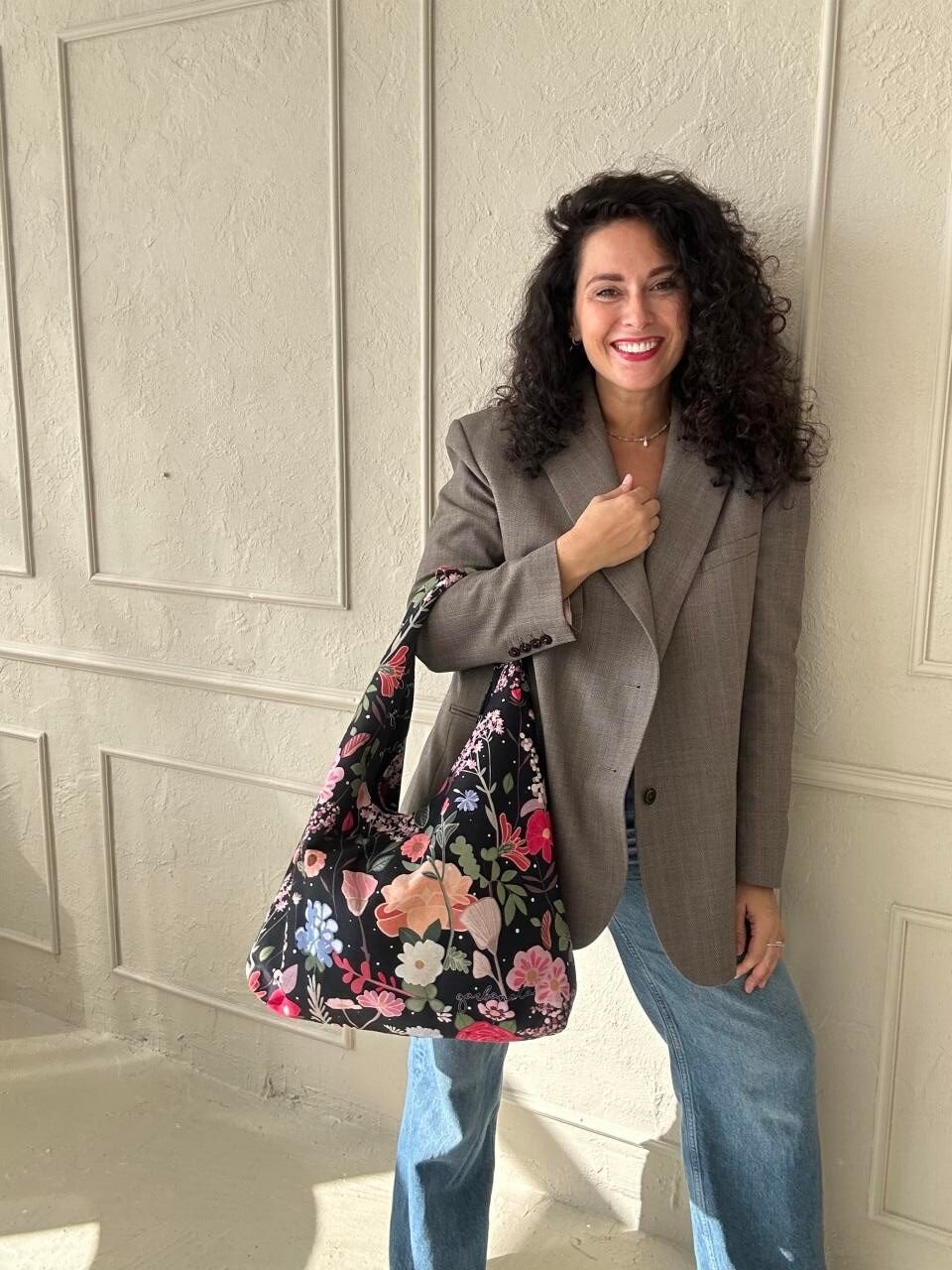 4. Woman posing with Garbanota Moon Bag - Curly Summer Night, floral print, casual outfit