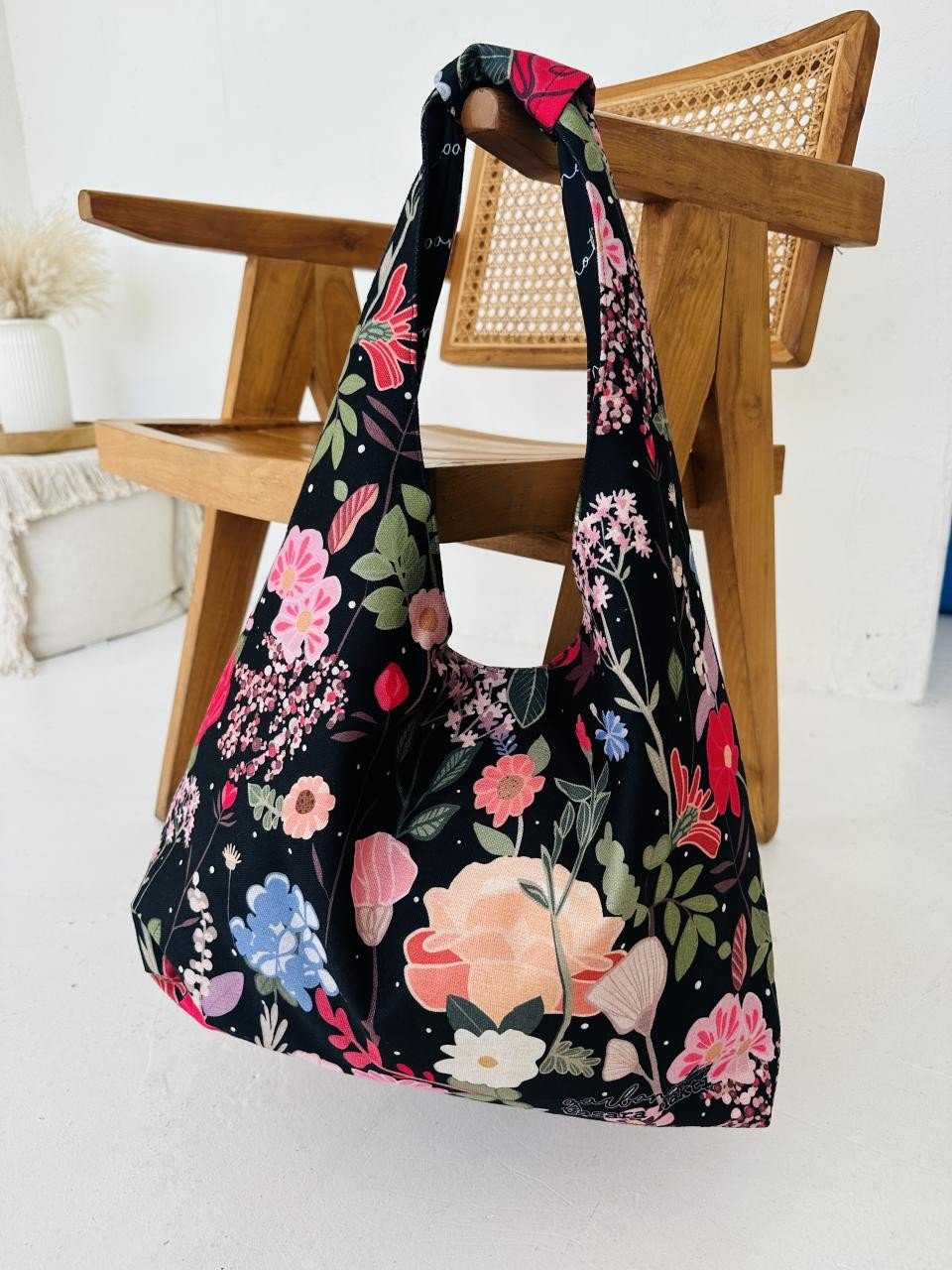 9. Garbanota Moon Bag - Curly Summer Night with floral pattern on wooden chair, lifestyle setting