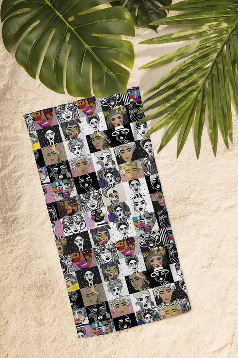 1. Garbanota Towel Mosaic in vibrant colors displayed on sand, showcasing artistic design and exceptional water absorption