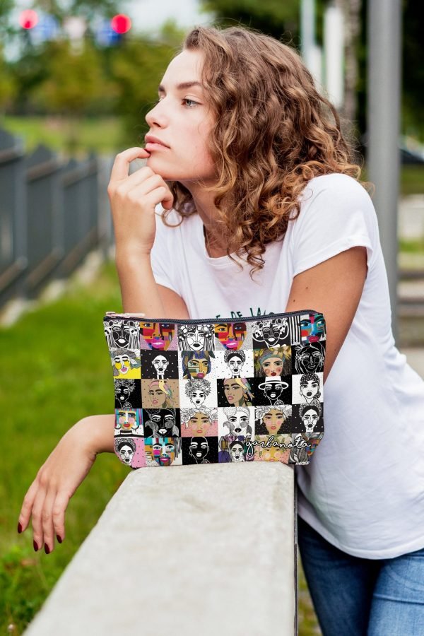 2. Woman holding Garbanota colorful mosaic makeup bag, displaying unique artistic prints in an outdoor setting