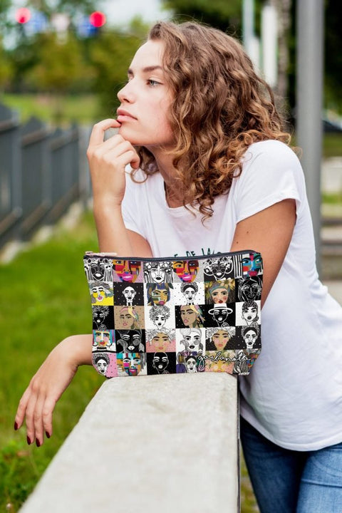 2. Woman holding Garbanota colorful mosaic makeup bag, displaying unique artistic prints in an outdoor setting
