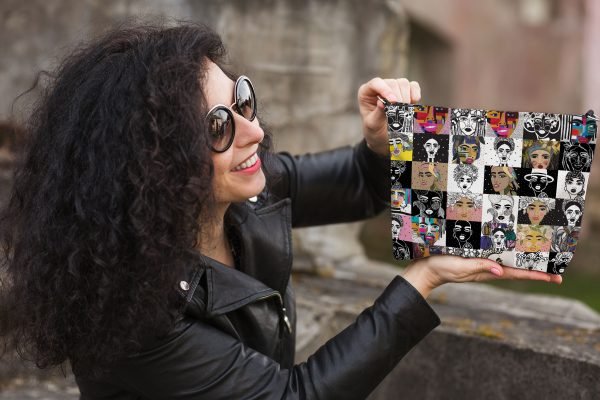 7. Woman showcasing Garbanota colorful mosaic makeup bag, emphasizing unique artistic prints and style