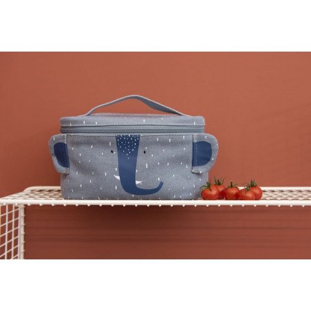 1. Trixie Baby Mr. Elephant thermal lunch bag on white shelf with red background and cherry tomatoes