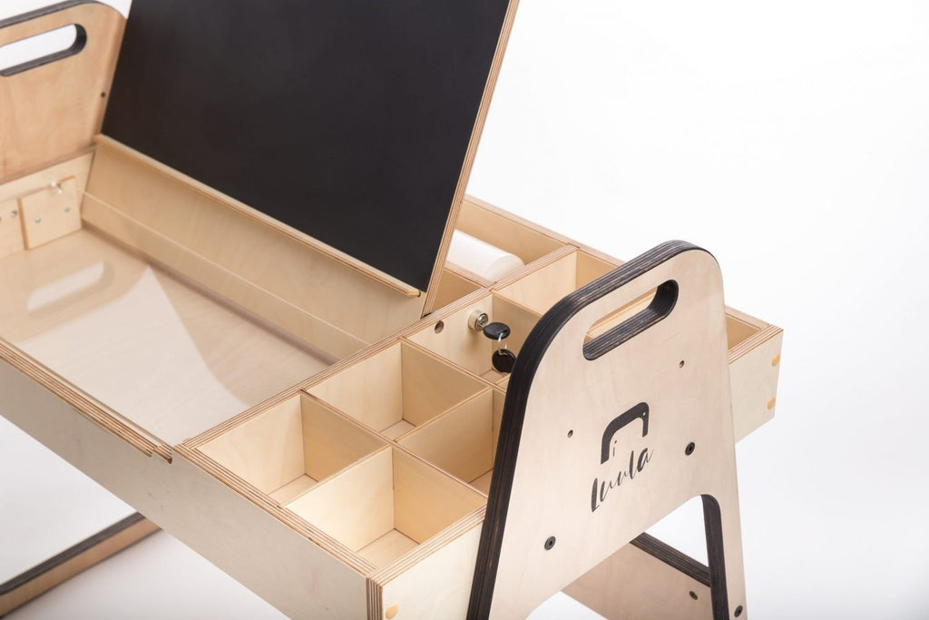 3. Detail of Luula Julle table with open lid revealing chalkboard and storage compartments