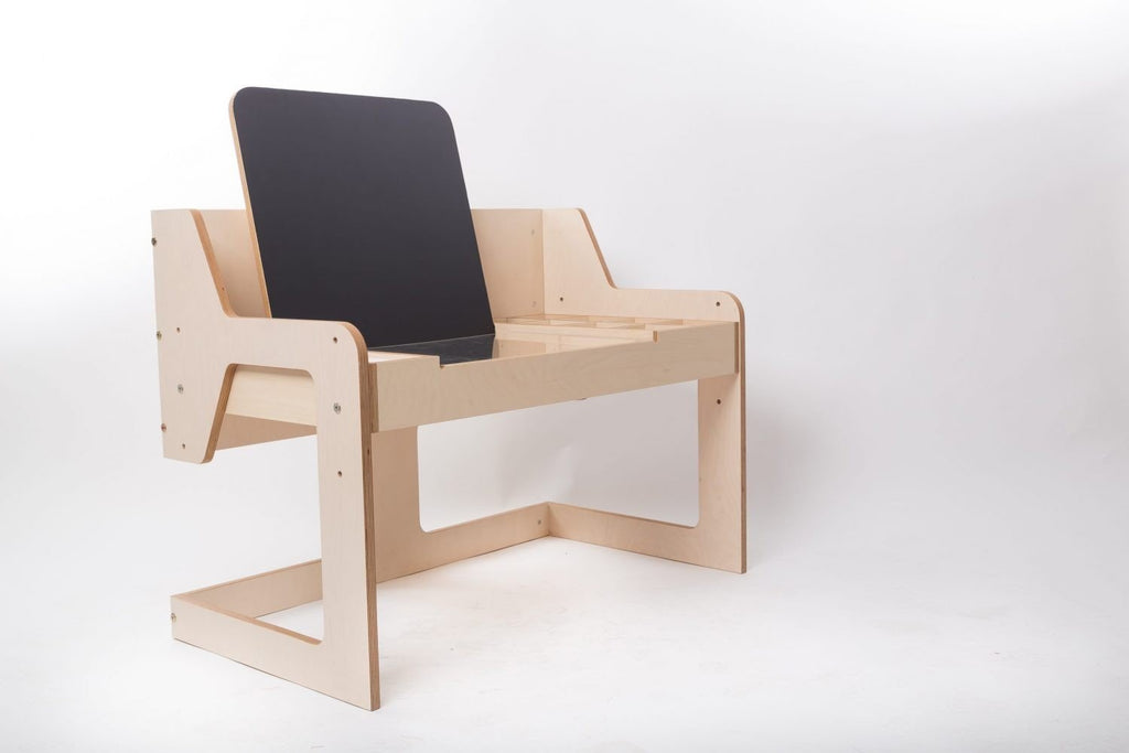 14. Luula table with chalkboard in studio setting, showcasing adjustable height and birch plywood material