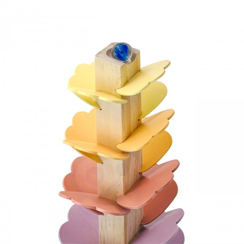 2. Close-up of pastel-colored wooden ball track with blue marble at the top