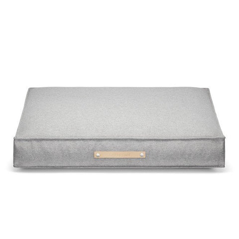2. Grey Møvik dog cushion by Labbvenn with classic rectangular shape, featuring a leather belt with embossed logo on the front, shown in studio setting highlighting its minimalist design and durable fabric.