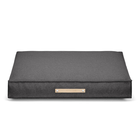 2. Labbvenn Møvik Cushion in light anthracite with leather belt and embossed logo, shown in studio setting highlighting its classic rectangular shape and durable fabric