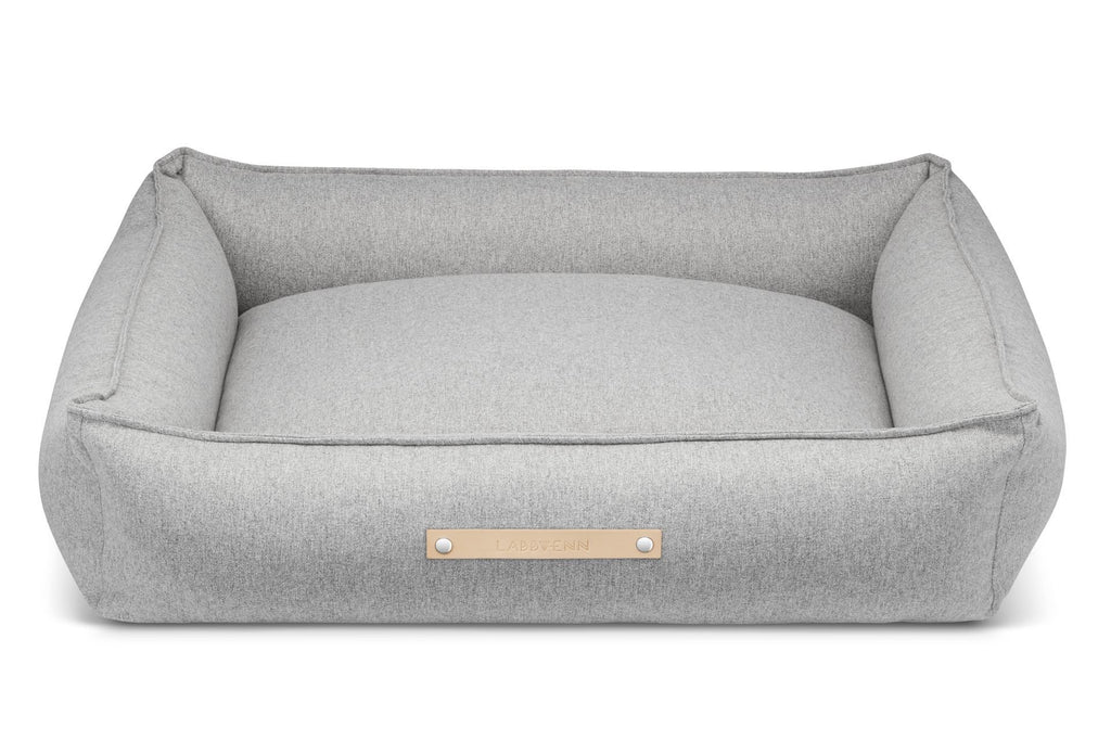 3. Studio shot of grey Møvik dog bed by Labbvenn with leather logo tag