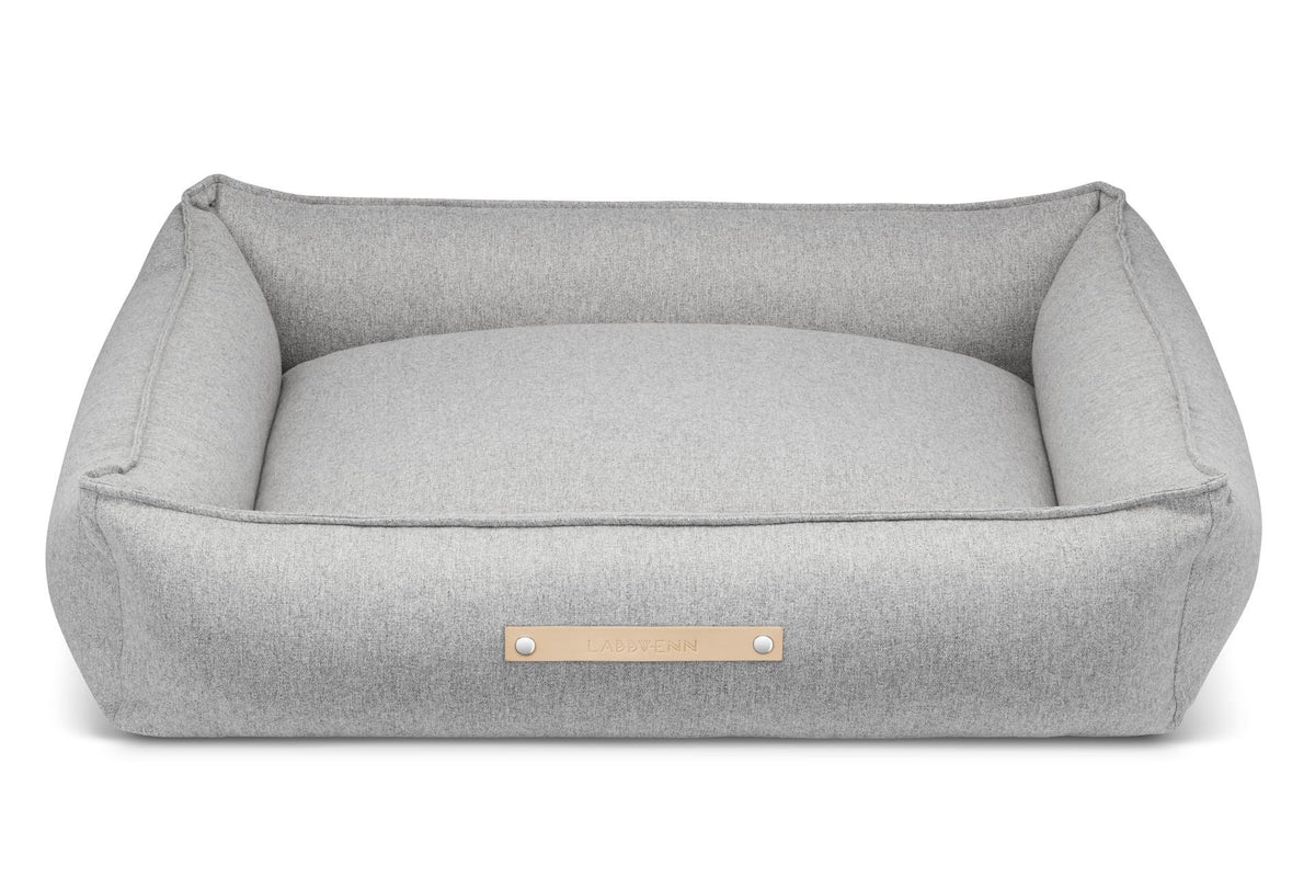 3. Studio shot of grey Møvik dog bed by Labbvenn with leather logo tag