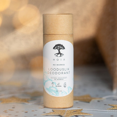 1. HOIA homespa Natural Deodorant No Worries 40ml in eco-friendly packaging with tree logo, set against a soft-focus background with golden star accents