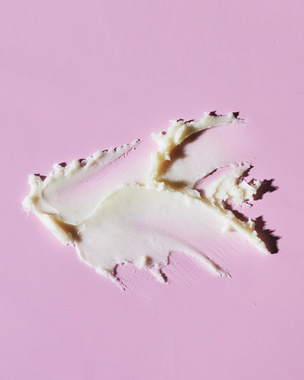 5. Close-up of smooth texture of Nurme natural deodorant on a pink background