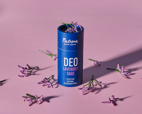 1. Nurme Lavender Sage natural deodorant in eco-friendly packaging surrounded by lavender flowers on a pink background