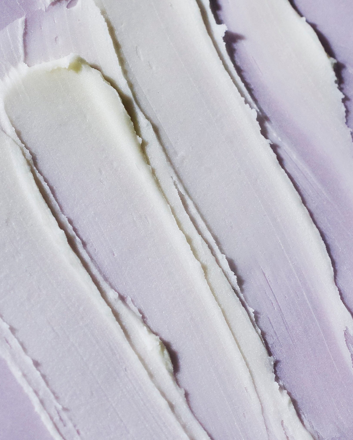 3. Close-up of creamy texture of Nurme Lavender Sage deodorant on a pink surface