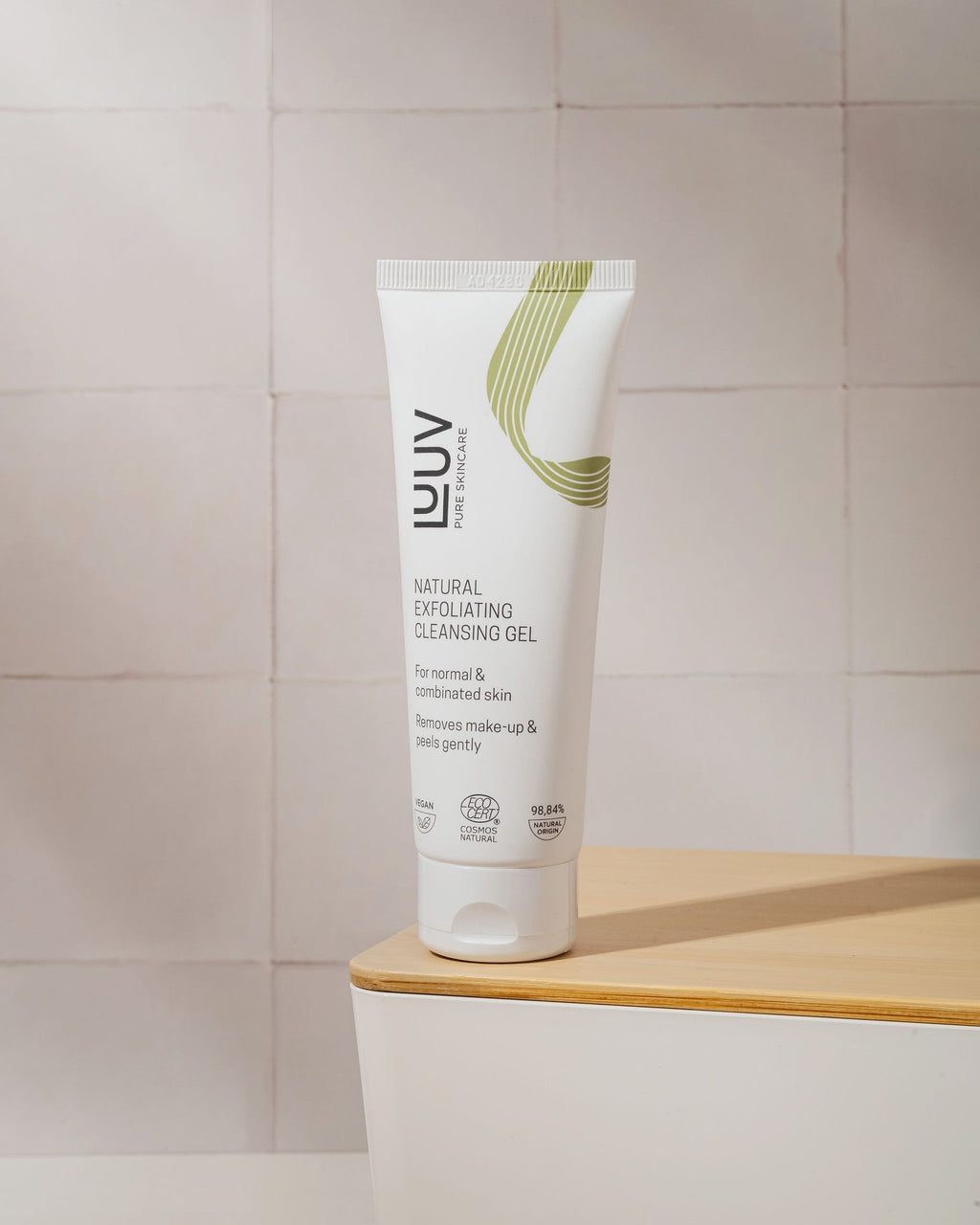 1. LUUV Natural Exfoliating Cleansing Gel with Bamboo, 75ml, on wooden surface with tiled background