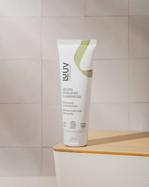 1. LUUV Natural Exfoliating Cleansing Gel with Bamboo, 75ml, on wooden surface with tiled background