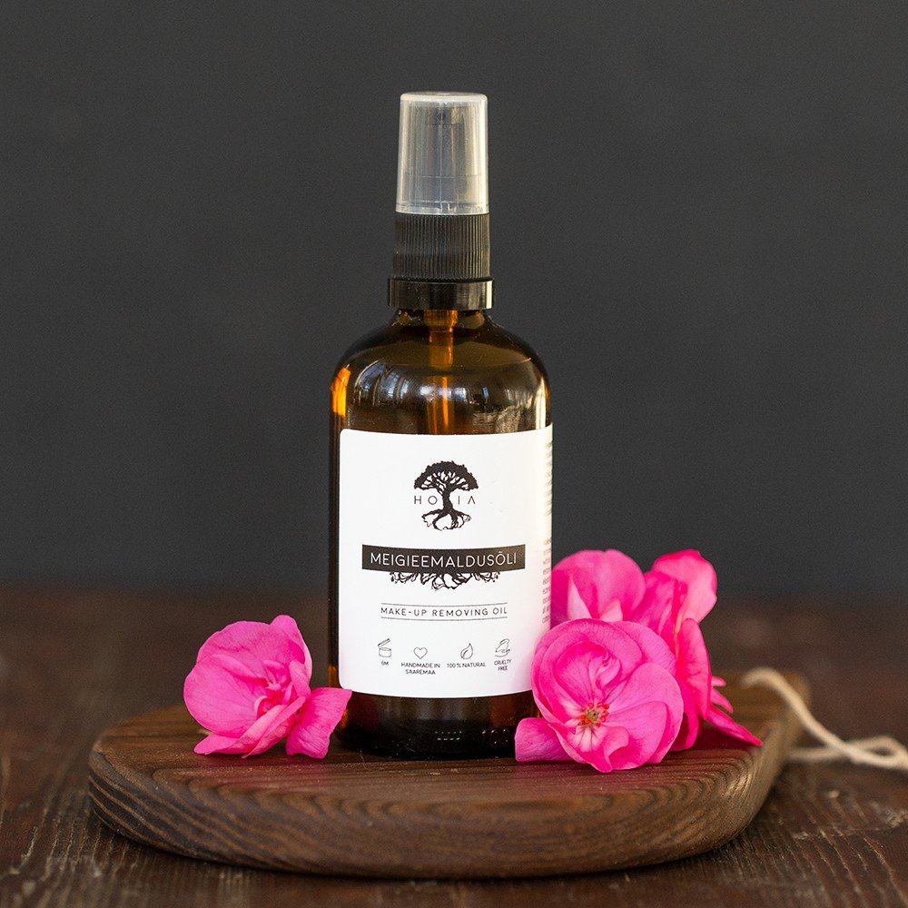 1. HOIA homespa Natural Makeup Remover Oil, 100 ml bottle on wooden tray with pink flowers, highlighting eco-friendly packaging and fragrance-free formula