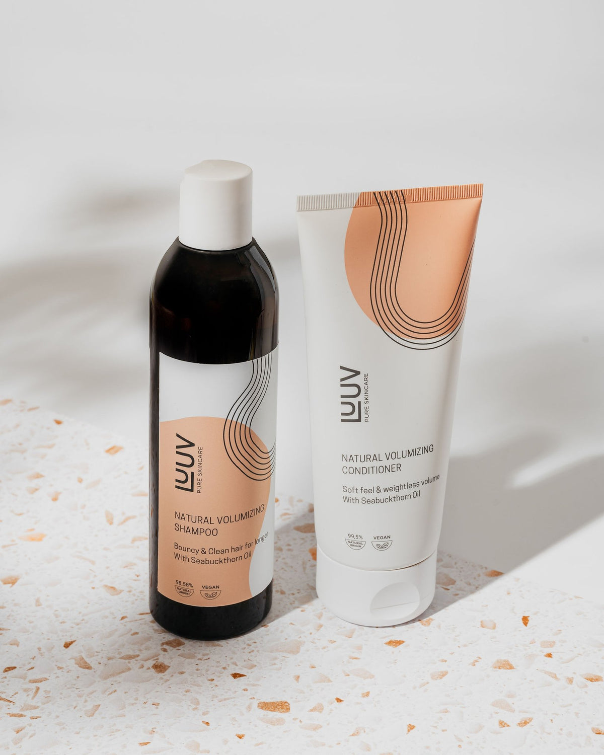 1. LUUV Natural Sea Buckthorn Shampoo and Conditioner Set displayed on a terrazzo surface, showcasing eco-friendly packaging