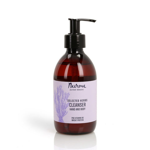 2. Nurme Natural Selected Herbs Hand and Body Cleanser in 300ml amber bottle with pump, featuring lavender illustration and text highlighting Pro Vitamin B5 and wheat protein on a white label, studio background