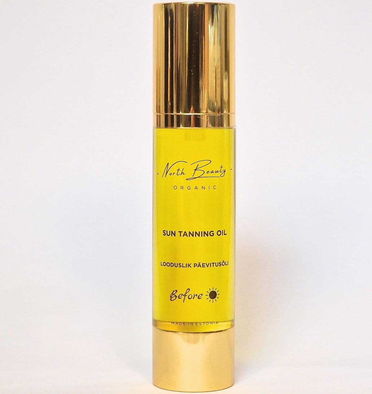 3. Studio image of North Beauty Natural Tanning Oil bottle, featuring product label and golden cap