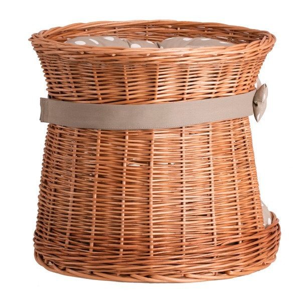 5. Side angle of wicker cat house with polka dot cushion, featuring a bow and sturdy construction.