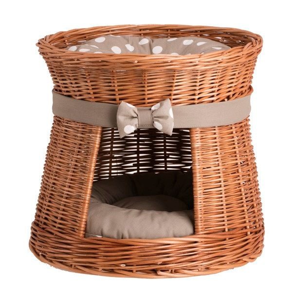 6. Front view of wicker cat house with plain cushion inside, showcasing the entrance and decorative bow.