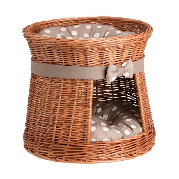 2. Front view of round wicker cat house with polka dot cushions and a bow, offering a cozy hideaway and perch for cats.