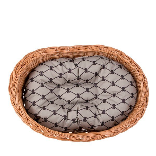 6. Overhead view of wicker dog bed with beige cushion, showing pattern and oval shape