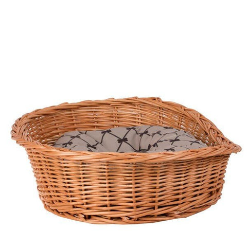 2. Side view of natural wicker dog bed with patterned beige cushion, highlighting woven texture