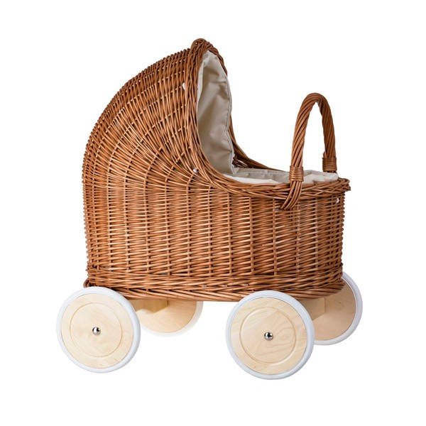 11. Side view of natural wicker doll pram with beige bedding and wooden wheels in studio