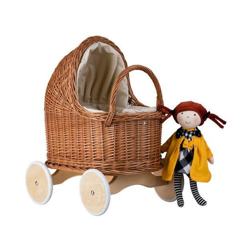 5. Natural wicker doll pram with beige bedding and a doll in yellow coat beside it