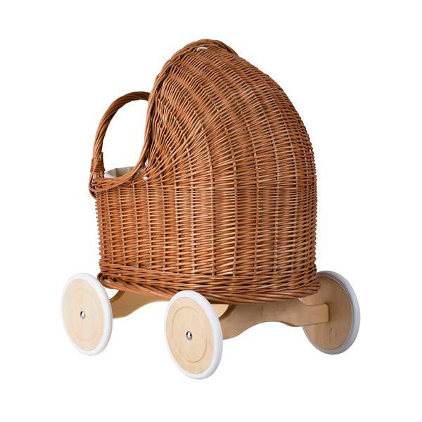 7. Angled view of natural wicker doll pram with beige bedding and wooden wheels