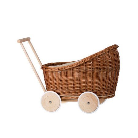 9. Side view of natural wicker doll pram with beige bedding and wooden frame