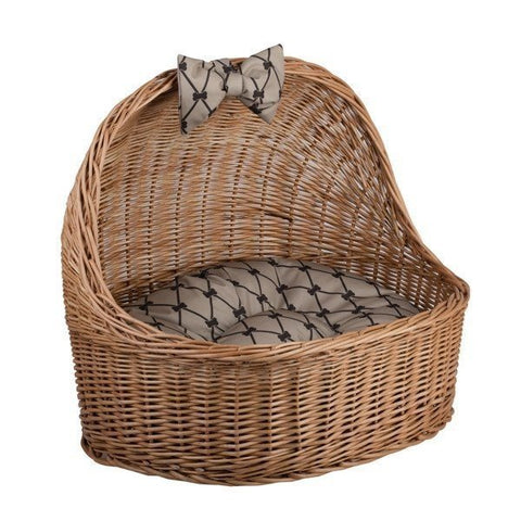 2. Angled view of natural wicker pet house showing interior cushion and decorative bow