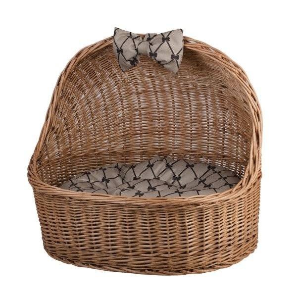 5. Angled front view of natural wicker pet house with patterned cushion and bow