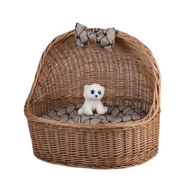 6. Front view of natural wicker pet house with decorative bow and small plush toy inside