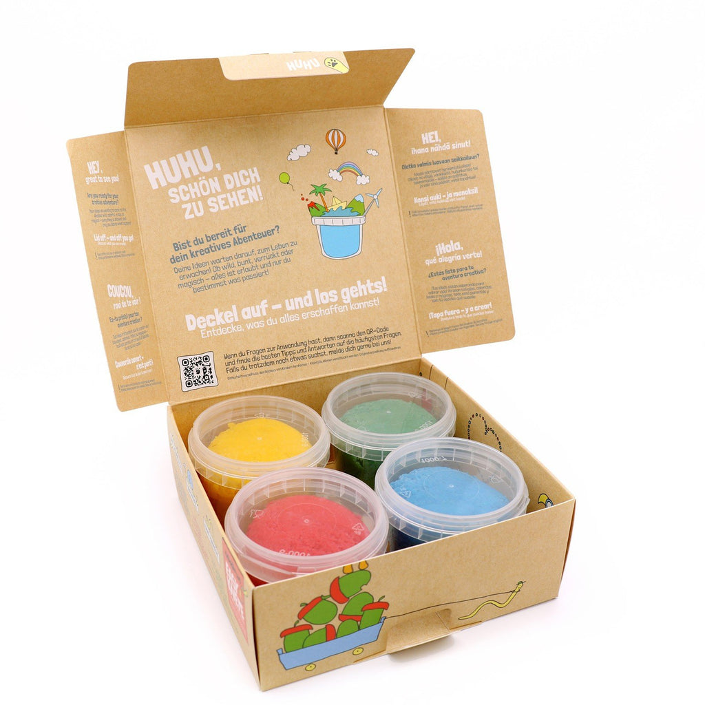 2. Open Neogrün Easy Clay box with four containers of yellow, green, blue, and red clay inside