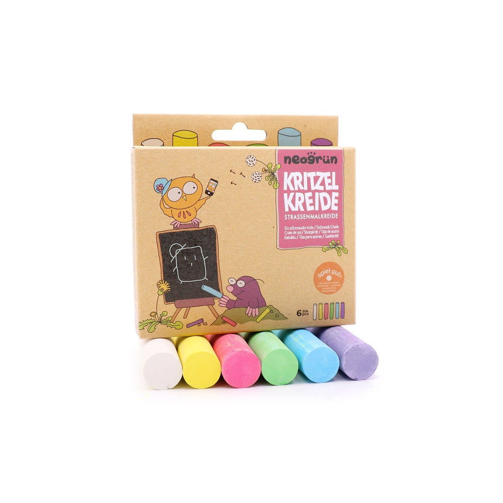 7. Flat lay of Neogrün chalks set with packaging and six chalks in white, yellow, red, green, blue, and violet