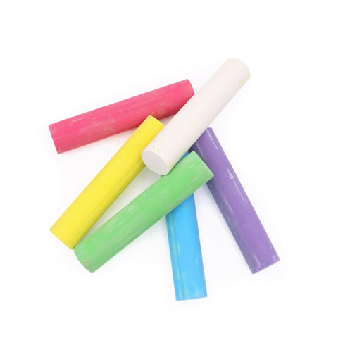 3. Close-up of Neogrün chalks scattered showing colors white, yellow, red, green, blue, and violet on a white background