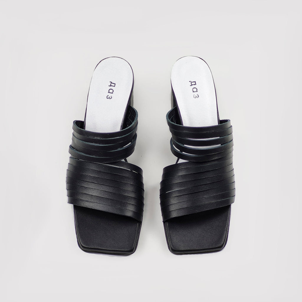 1. Women's handmade strappy matt leather sandals in black, top view showing sleek design and squared toe