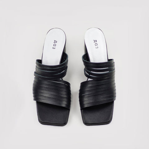 1. Women's handmade strappy matt leather sandals in black, top view showing sleek design and squared toe