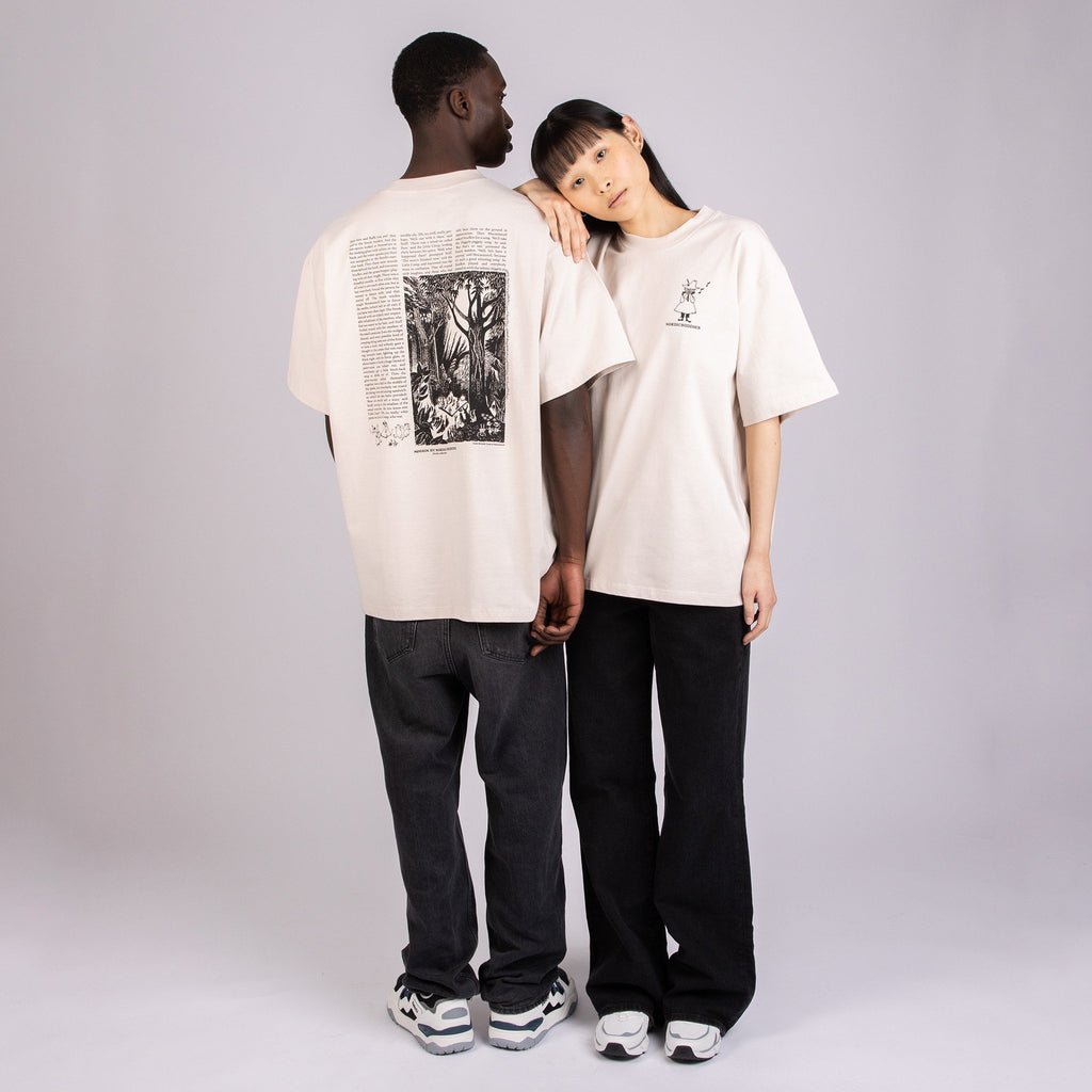1. Unisex beige Moomin t-shirt worn by male and female models, showcasing back design in studio setting